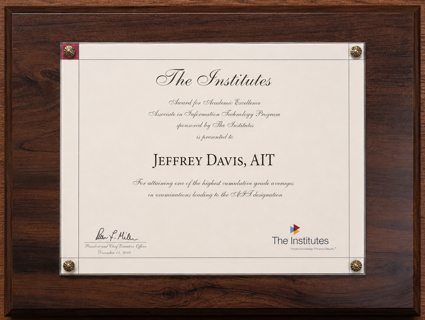 The Institutes Award for Academic Excellence presented to Jeff Davis for one of the highest cumulative grade averages leading to the AIT designation